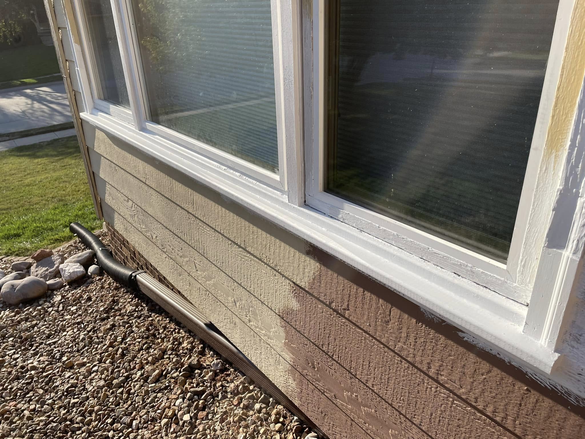 Repaired window trim and fresh siding