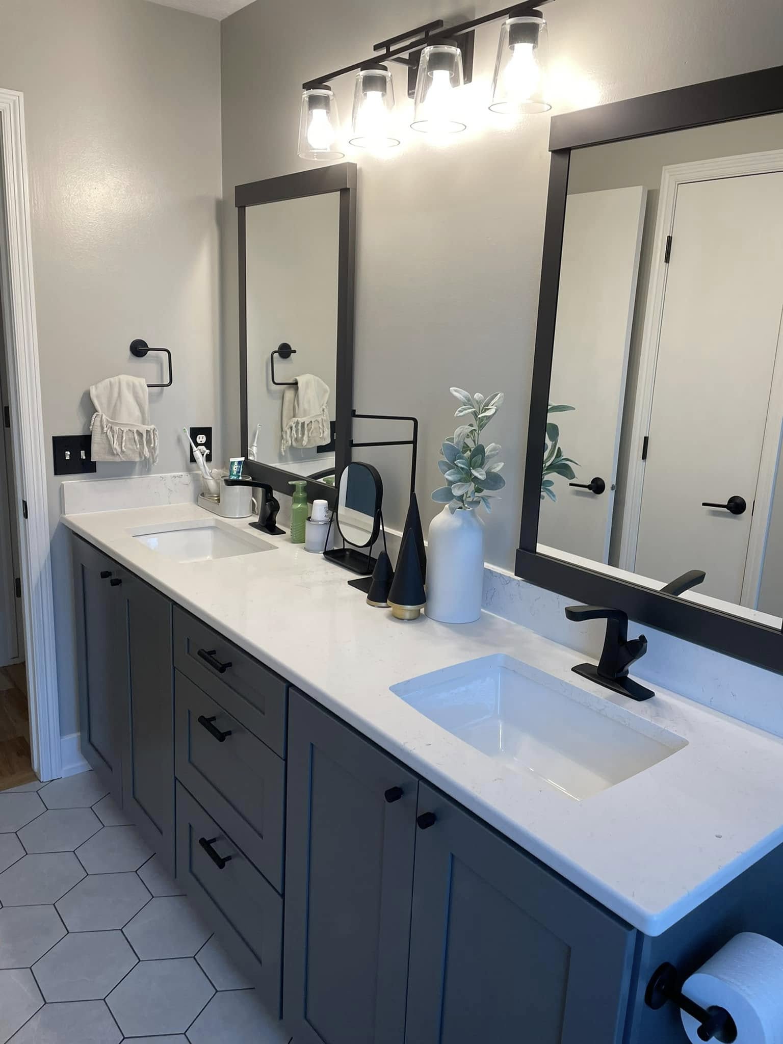 After: double vanity with quartz countertop and hex tile floor